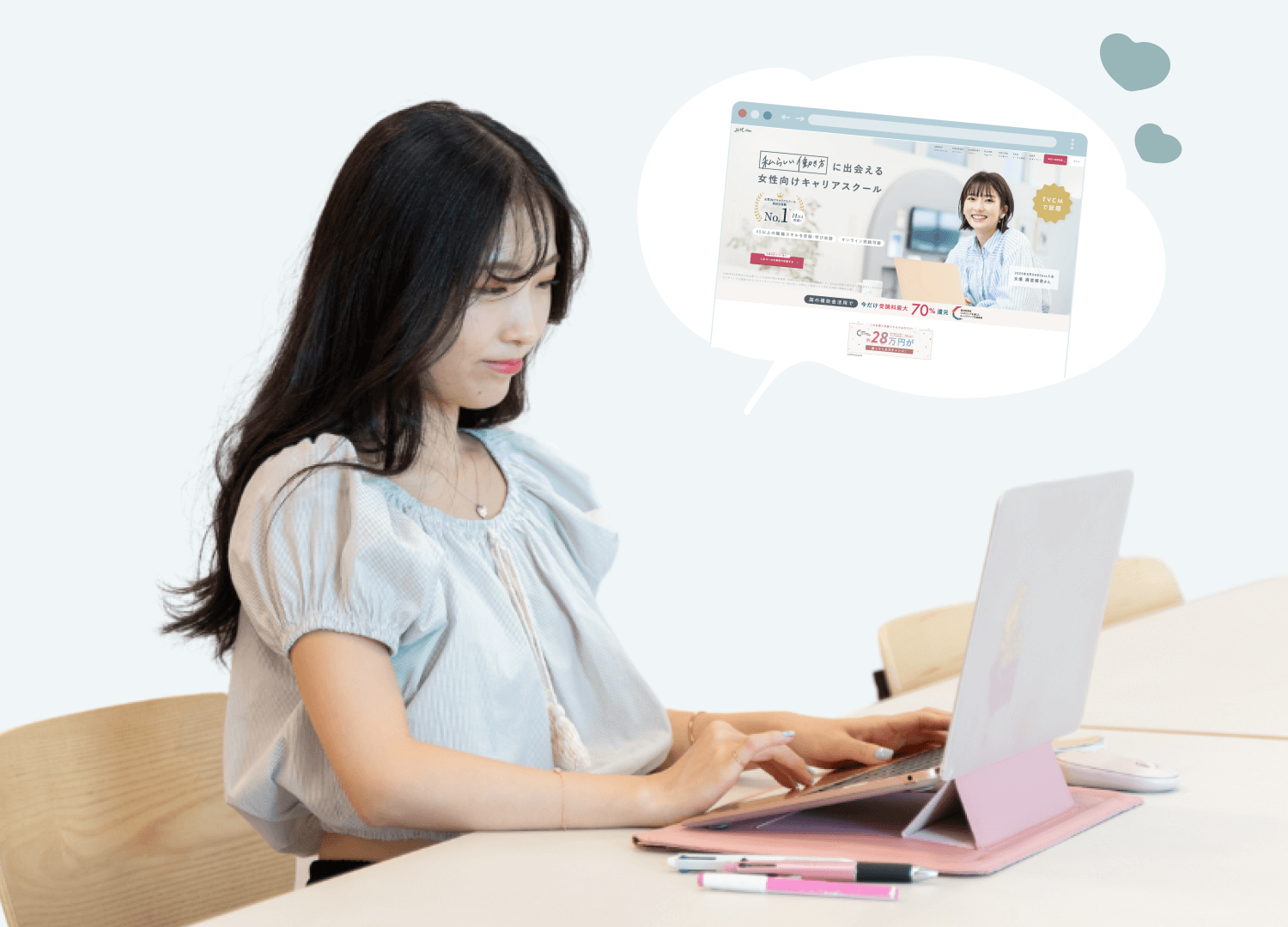 ピンクのタブレットで作業するNabiさん。頭上にはSHElikes公式サイトのイメージを示す吹き出し